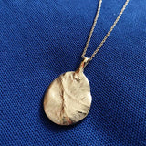 Gold Pendant created using a baby palm print the T.I.Y KIT cast in recycled silver and gold plated
