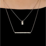 Carse Tube Necklace by Laura Nelson - A simple and minimal sterling silver necklace